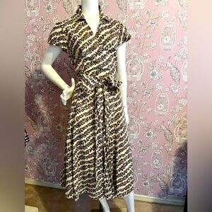Wrap top dress with A line full skirt in vanilla and brown vine print